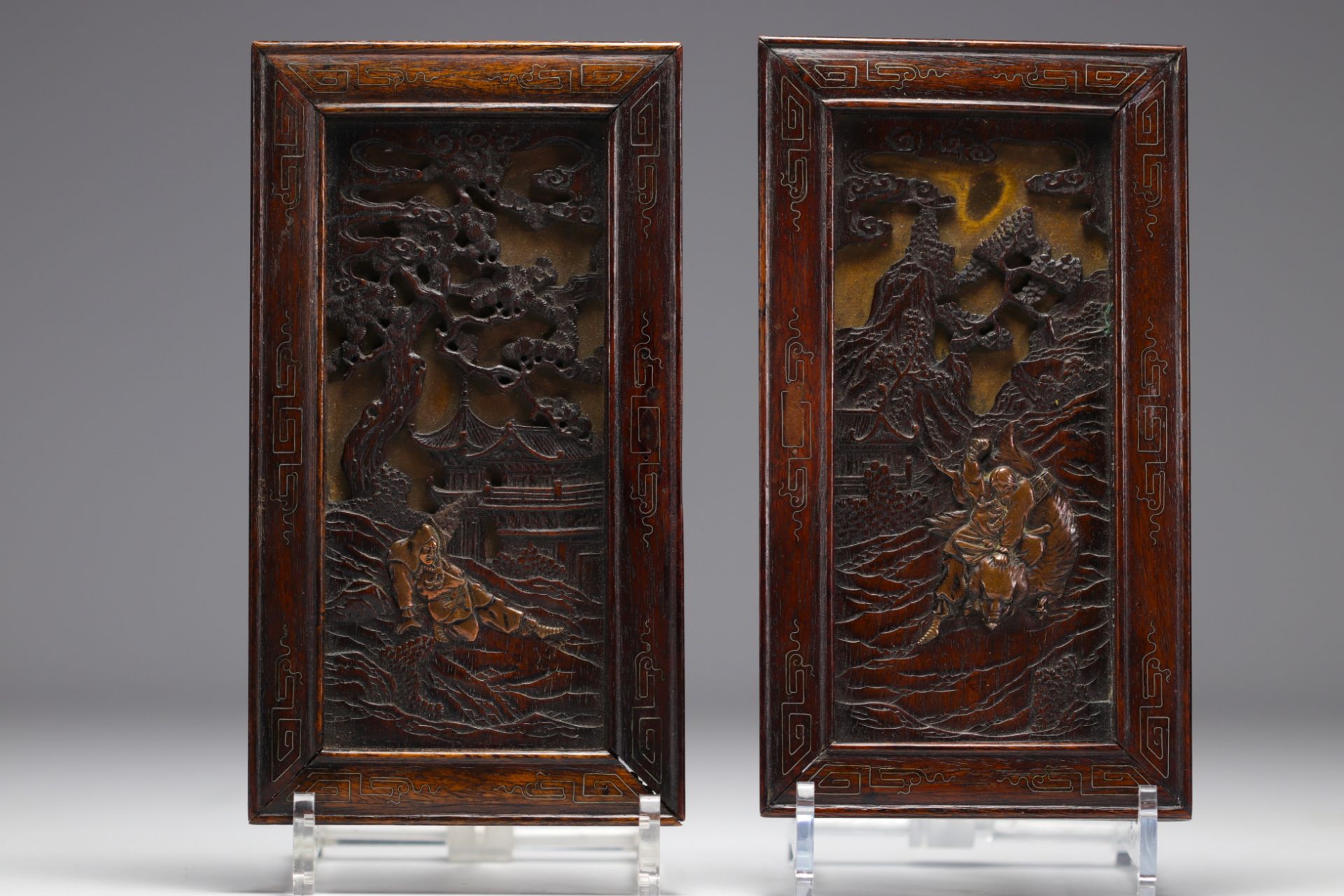 Japan - Pair of small carved wooden panels, bronze figures, filigree frames, Meiji period.