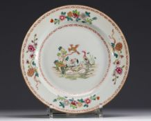 China - A pink family polychrome porcelain plate decorated with ducks and flowers, 18th century.