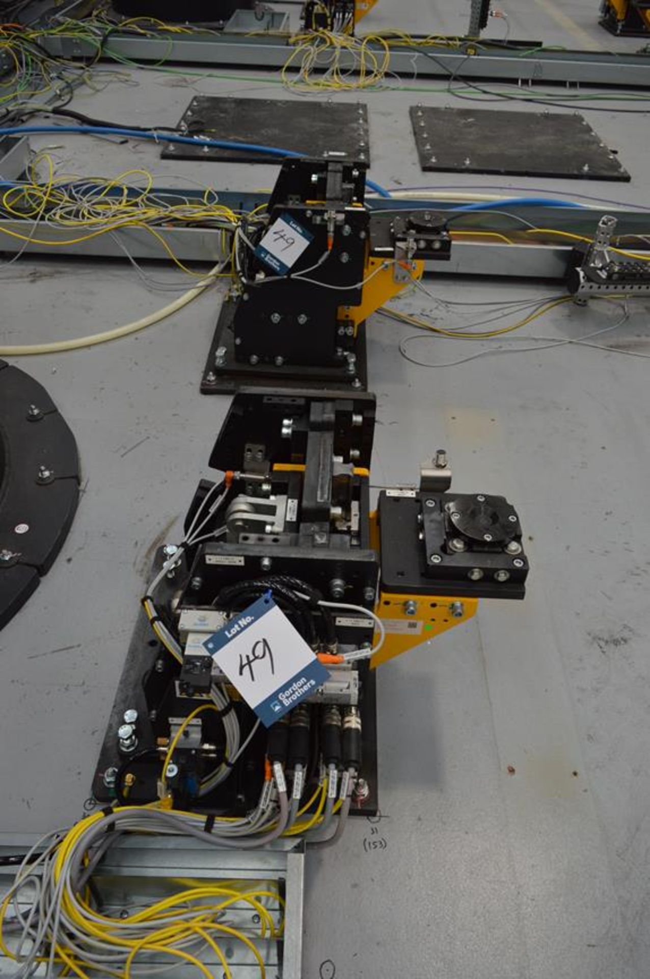 Set of eight robot tool stands with pneumatic attachments