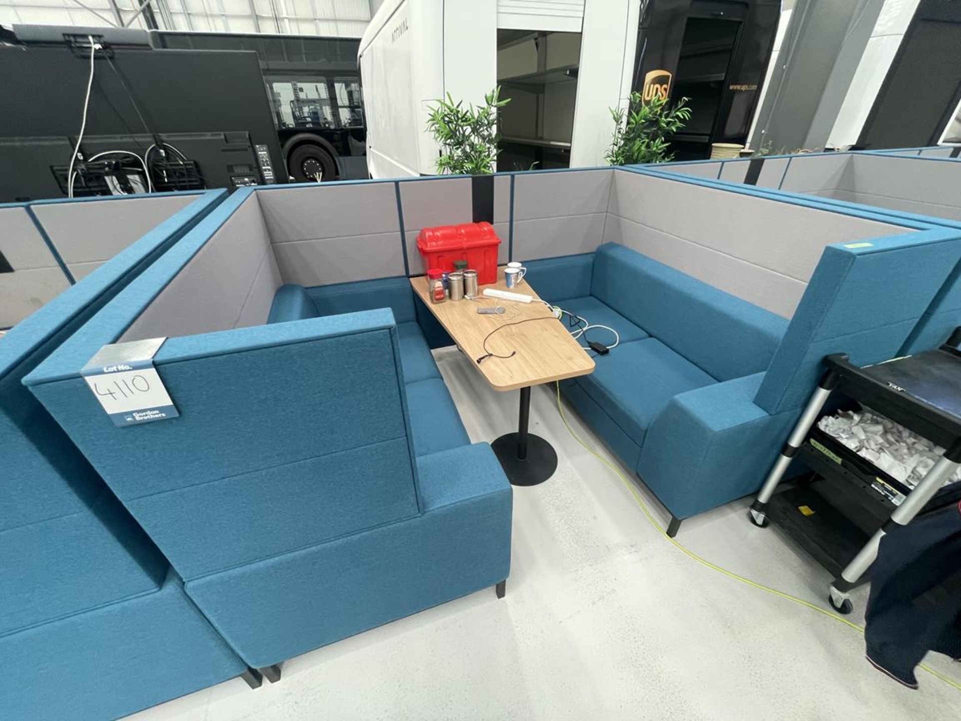 Sixteen3 Blue upholstered seating booth with wired table