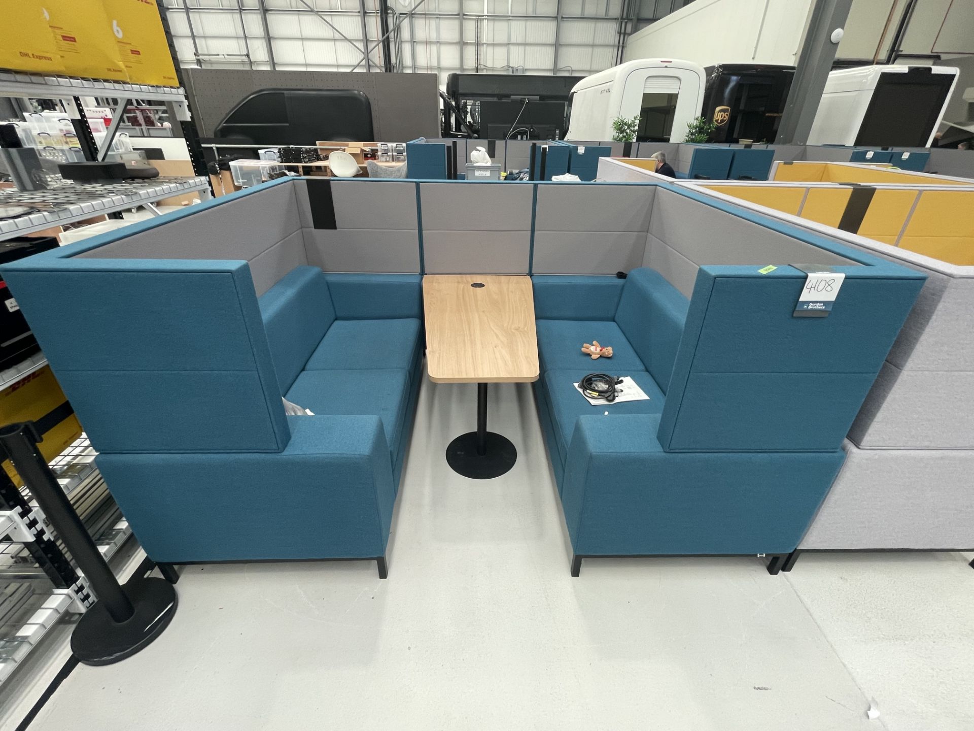 Sixteen3 Blue upholstered seating booth with wired table