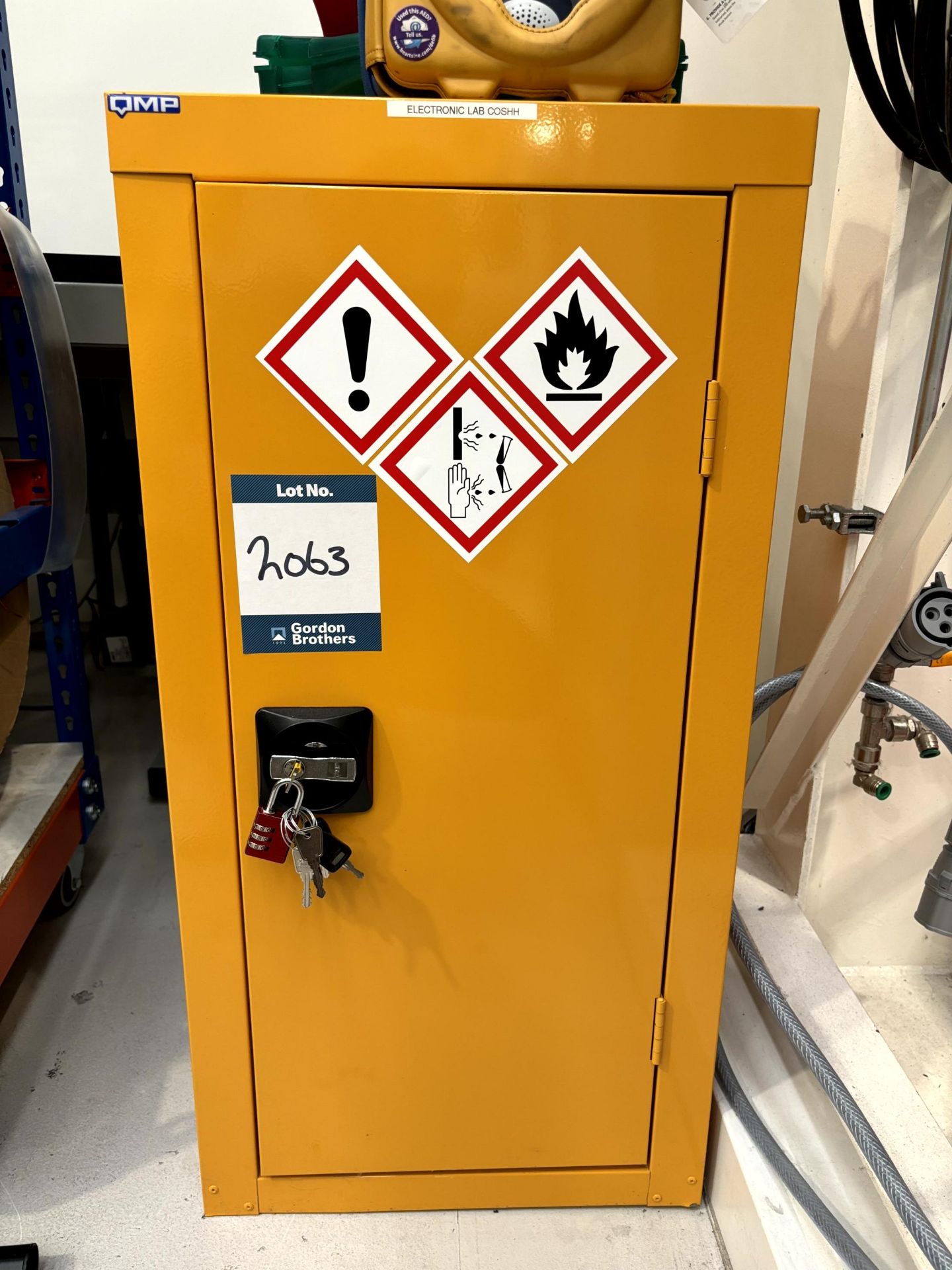 Chemical storage cabinet with key