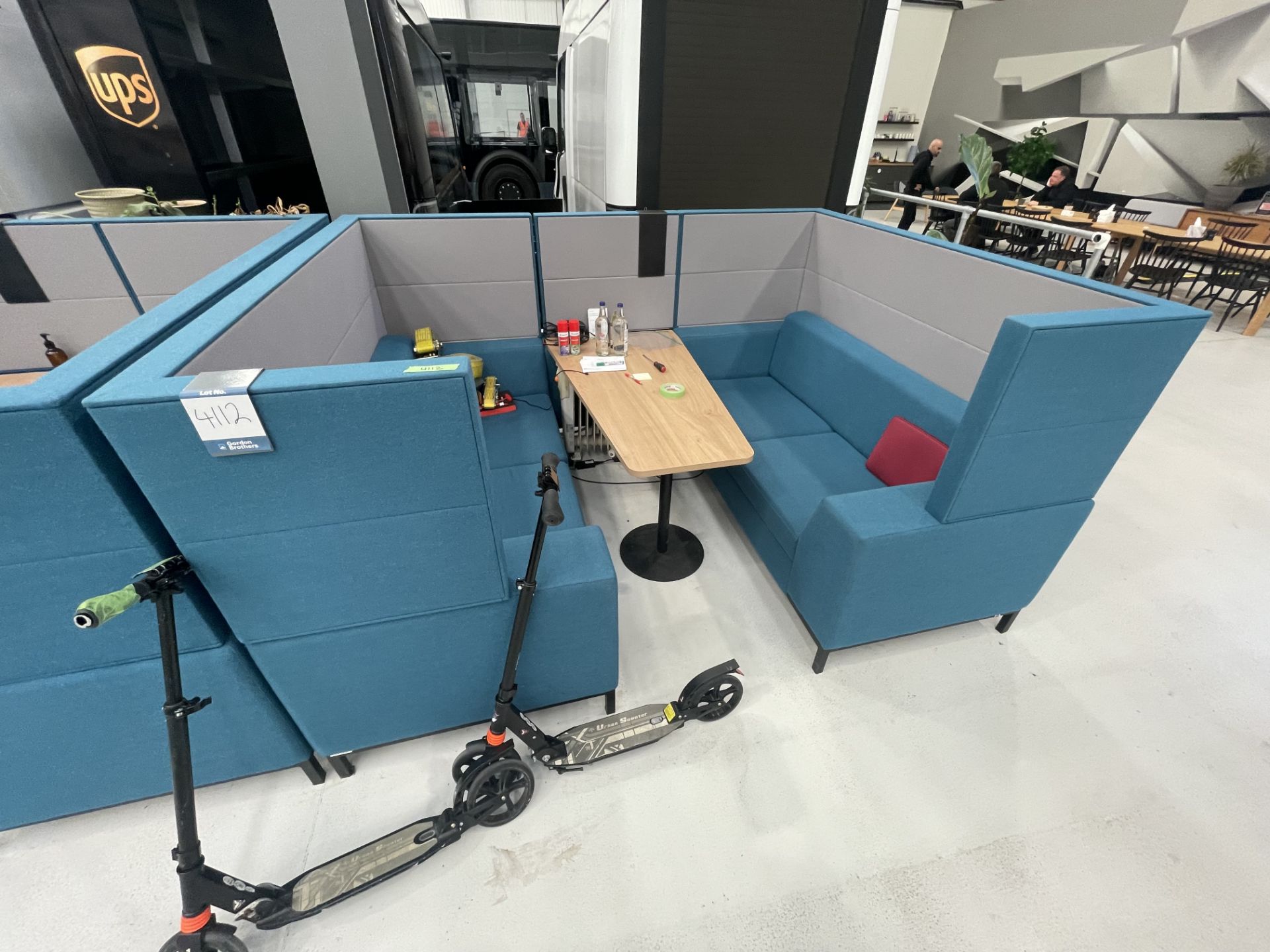 Sixteen3 Blue upholstered seating booth with wired table