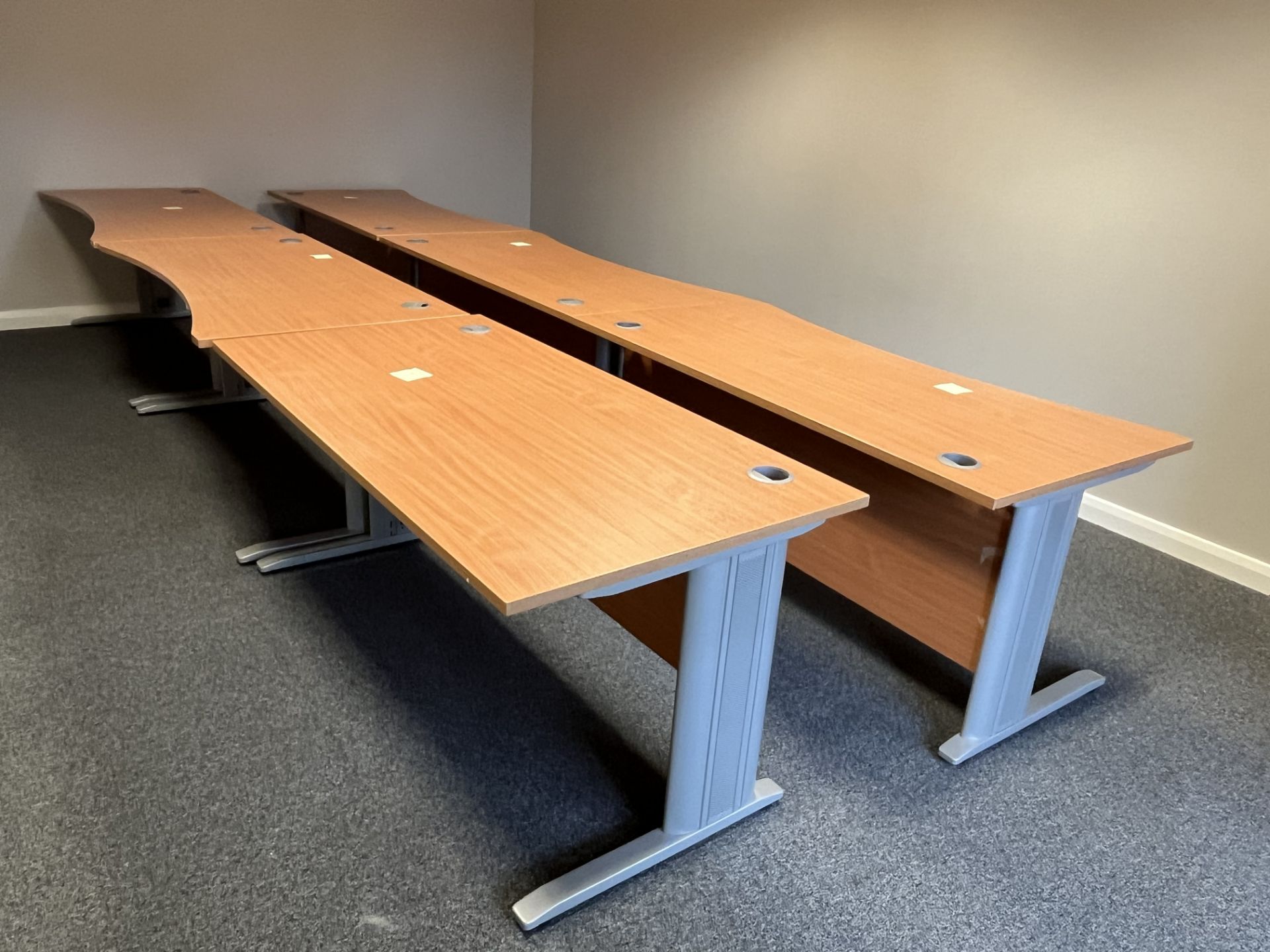 5x (no.) shaped front light oak veneer desks, a rectangular light oak veneer desk and a light oak