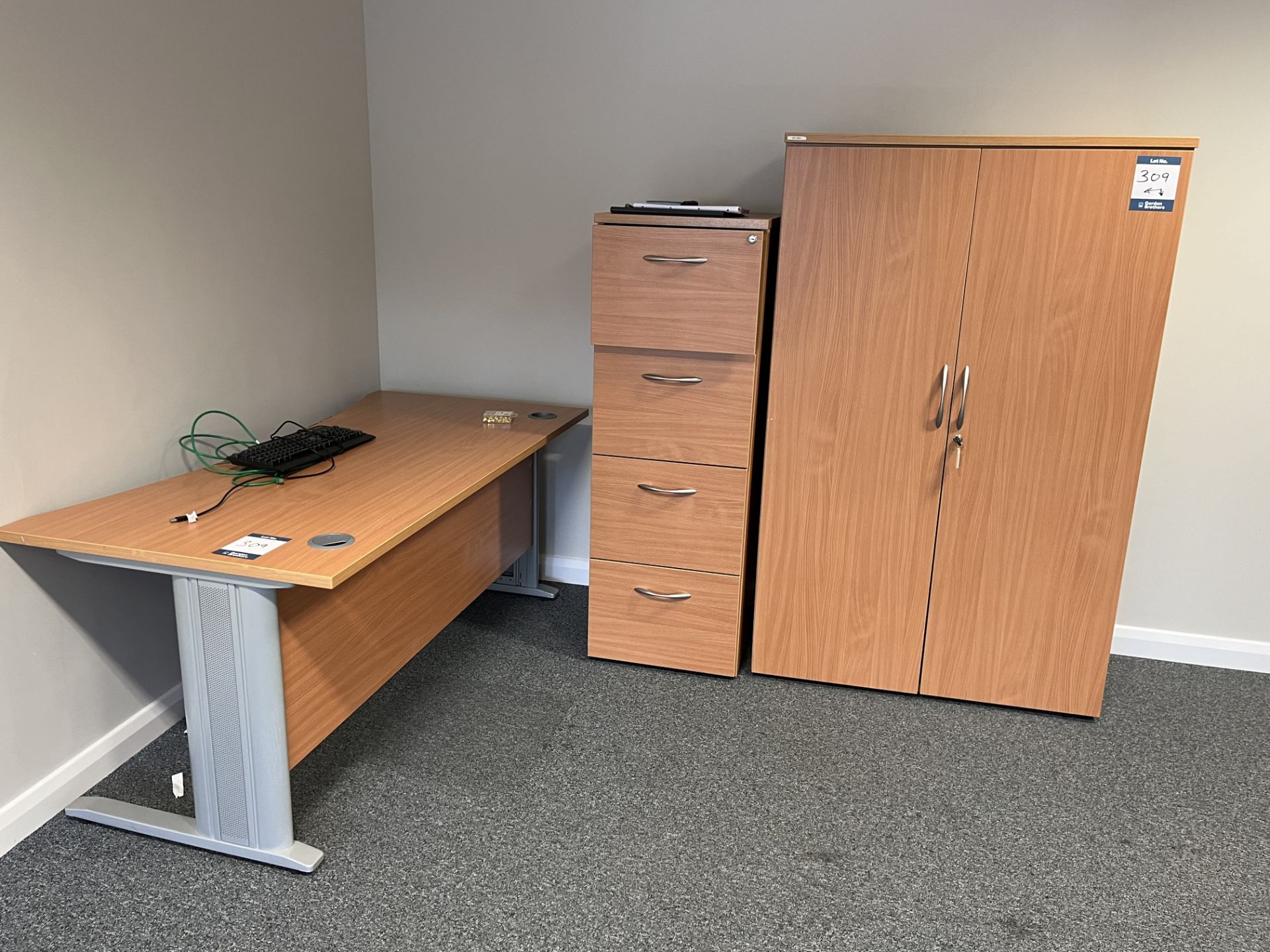 Shaped front light oak veneer desk, four drawer filing cabinet and light oak veneer double door