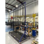 Metal framed, seventeen section vertical transporter rack, 2500 x 1200 x 3200mm approx. (contents