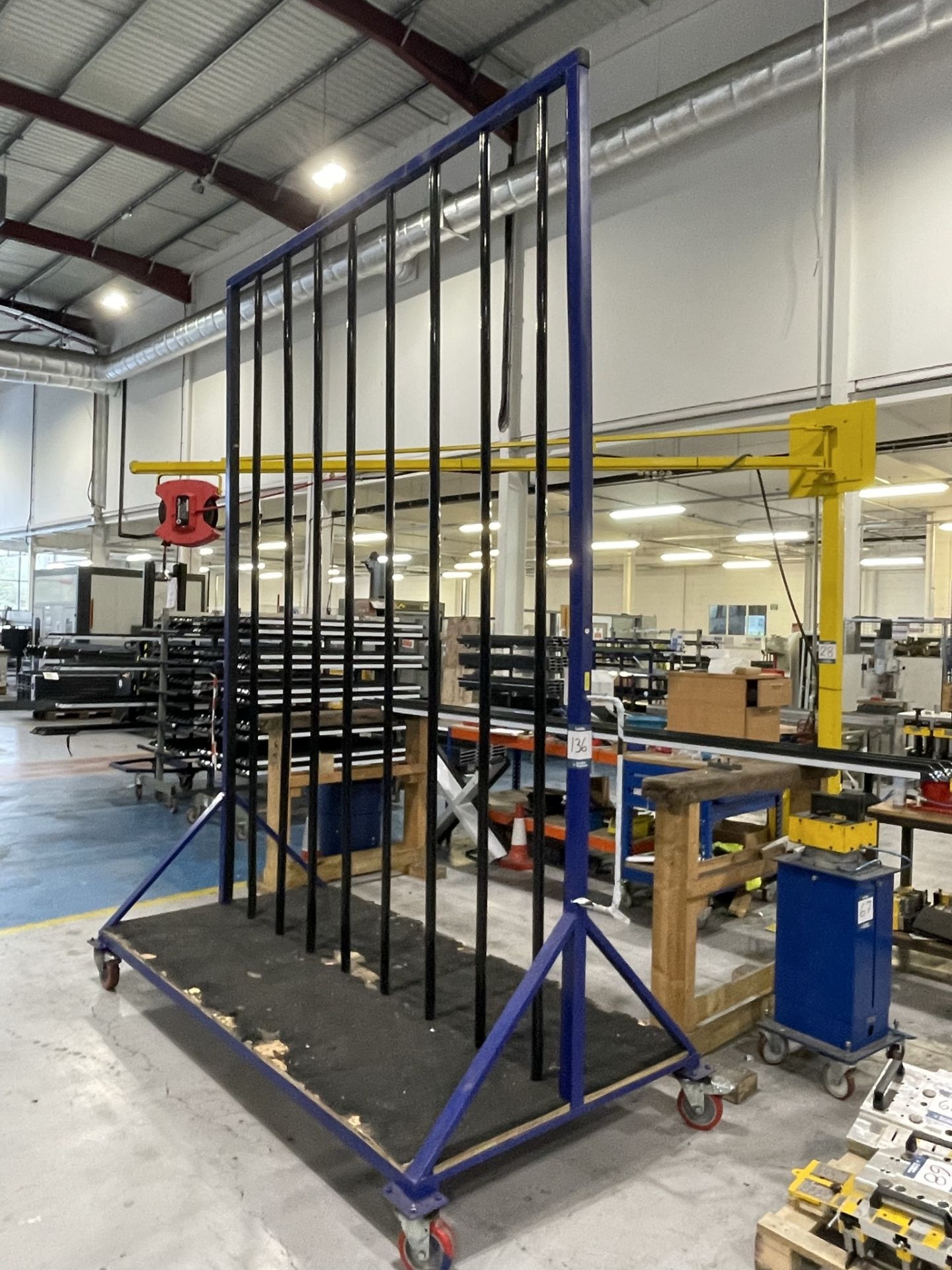 Metal framed, seventeen section vertical transporter rack, 2500 x 1200 x 3200mm approx. (contents