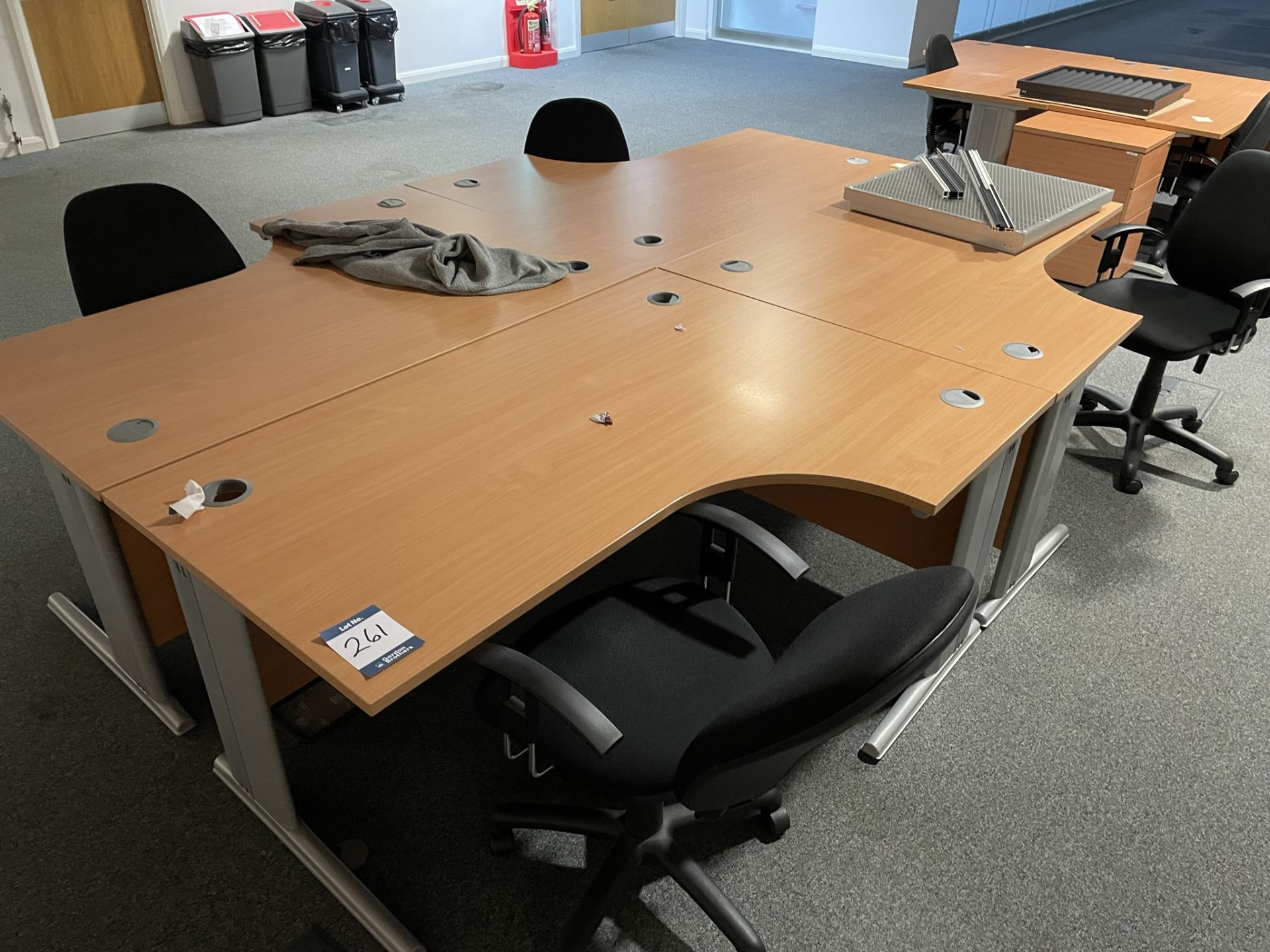 4x (no.) curved front light oak veneer desks, 4x (no.) operator chairs and 2x (no.) pedestals