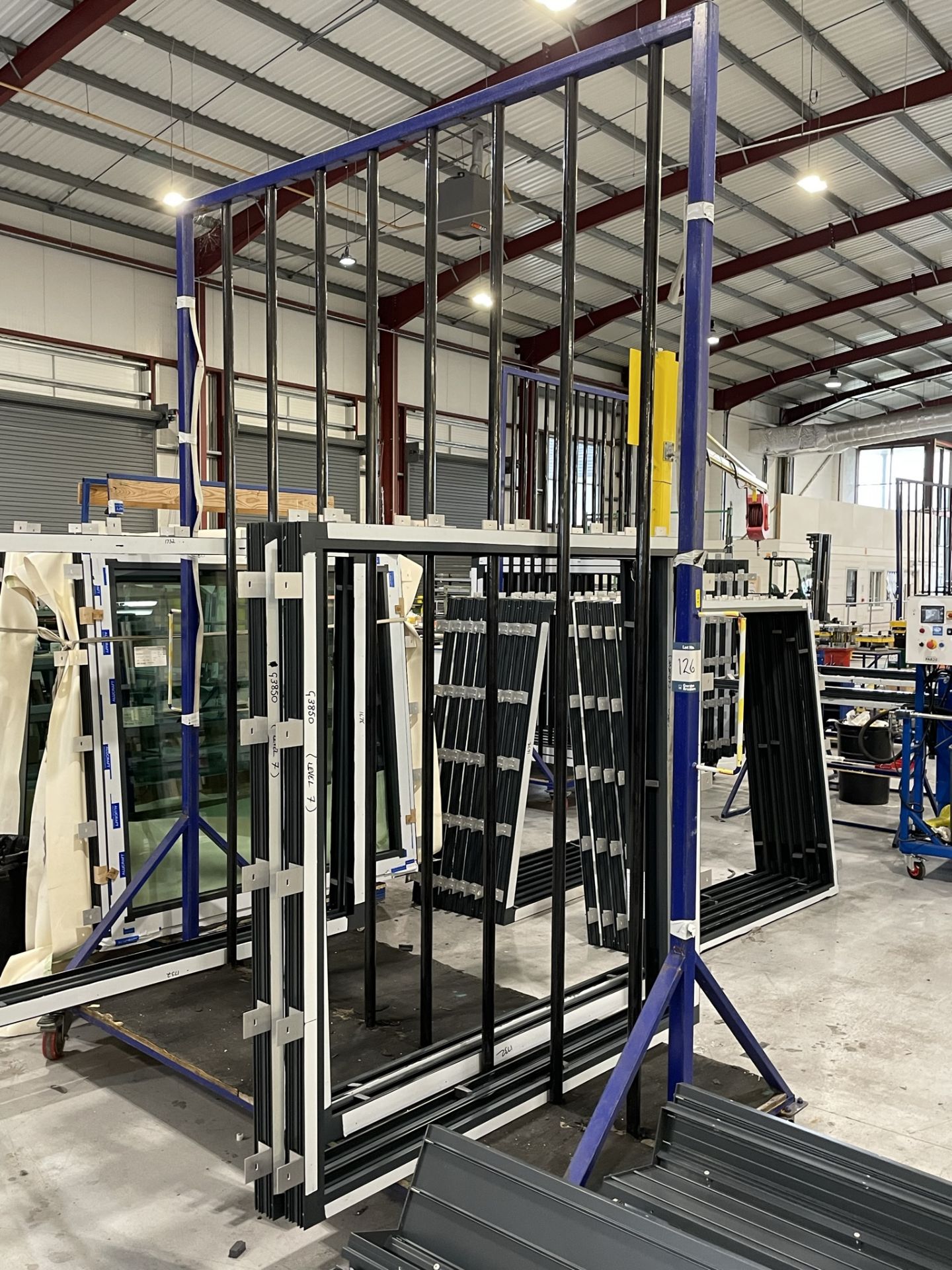 Metal framed, seventeen section vertical transporter rack, 2500 x 1200 x 3200mm approx. (contents