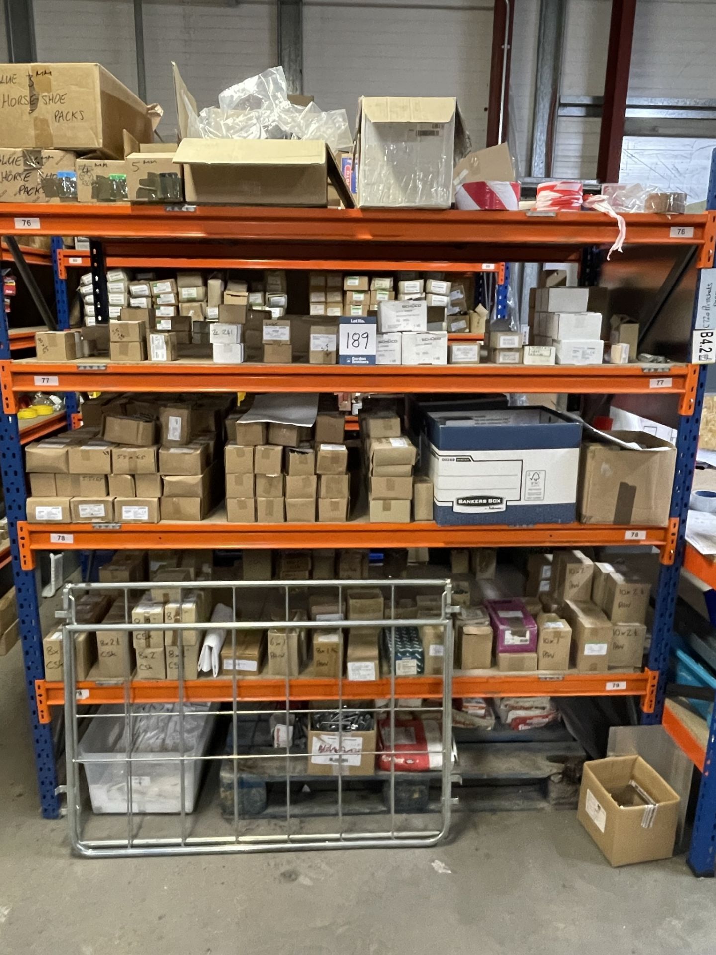 Large quantity industrial fixing and consumables on 3x (no.) racks, as lotted