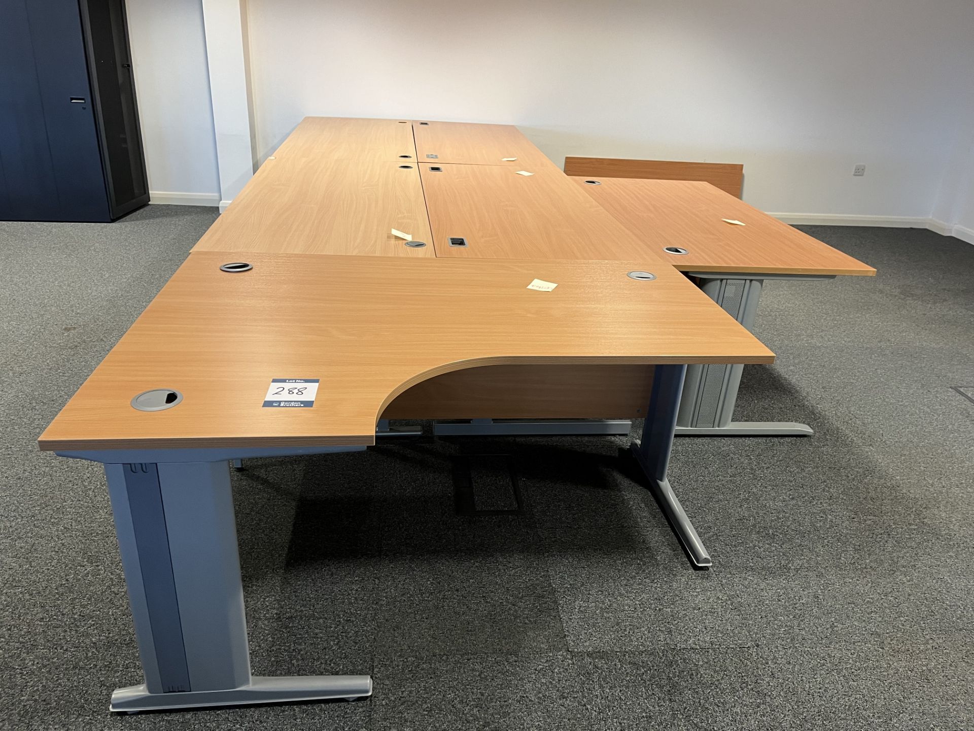 5x (no.) rectangular light oak veneer desks and a shaped front light oak veneer desk