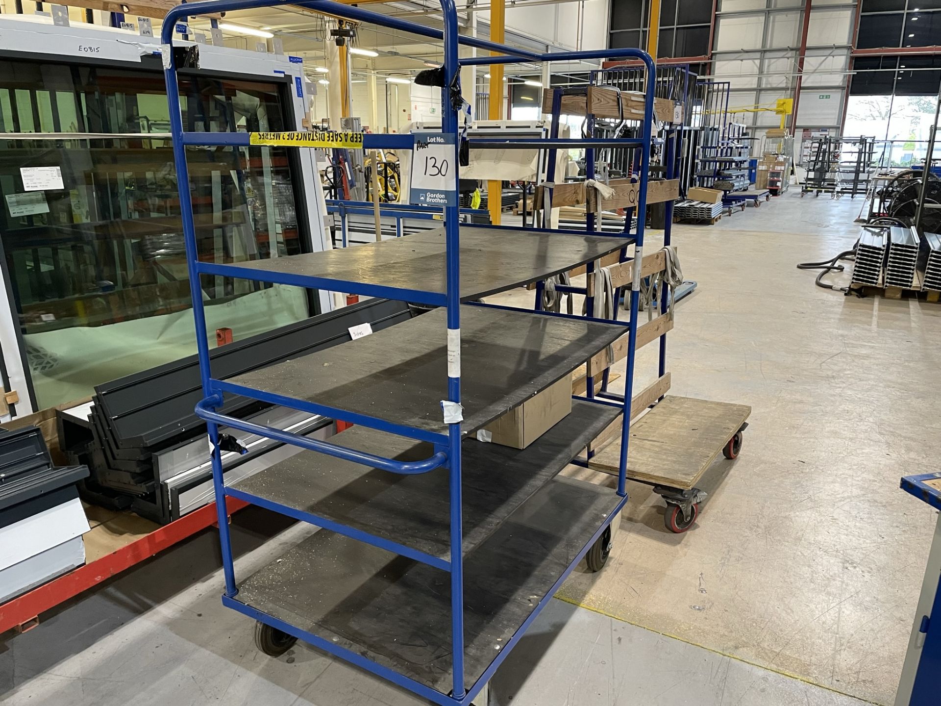 2x (no.) metal framed double sided transporter racks and metal framed, five tier transporter rack (