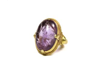 An Amethyst Gold Ring with Islamic Inscription in the Style of the 12th-13th Century. Ring Size: