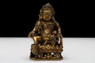 A Fine Tibetan Bronze Gilt God of Wealth Kubera Buddhist Statue from the 19th Century. H: