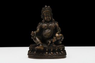 A Tibetan Bronze Buddhist Jambhala Statue from the 19th Century. H: Approximately 8cm Part of a