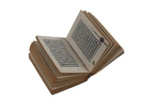 An Islamic Printed Qur'an (Smallest Ever Printed) with a Metal Box. An Ottoman War Qur'an that