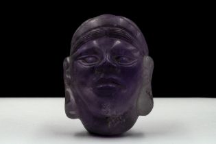 A Rare Middle Eastern Amethyst Carved Head. H: Approximately 5.4cm