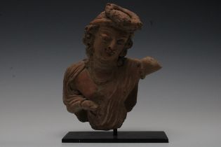 A Rare Terracotta Head with a Body Fragment Possibly Ancient on a Black Metal Base. H: Approximately