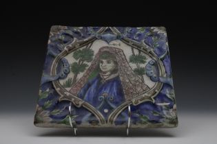 A Qajar Moulded Tile from the 19th Century Depicting an Armenian Woman. H: Approximately 20.7cm L: