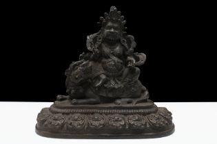 A Chinese Tibetan Bronze Buddhist Statue of Vaishravana on a Lion. H: Approximately 18.5cm