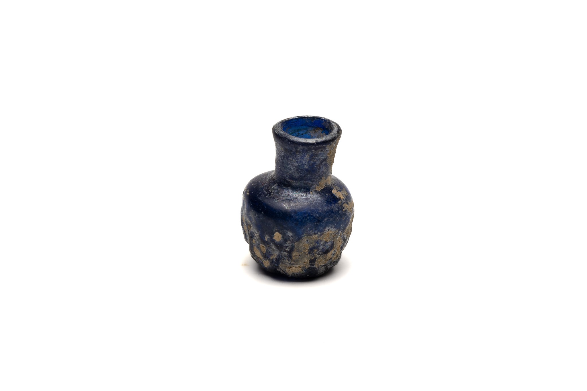 An Islamic Small Blue Moulded Glass with Patina from the 11-12th Century.

H: Approximately 5cm  - Image 2 of 3