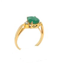 An Emerald and Diamond Ring in Yellow 18K Gold.

Emerald Weight: Approximately 1.8ct
2.4g 