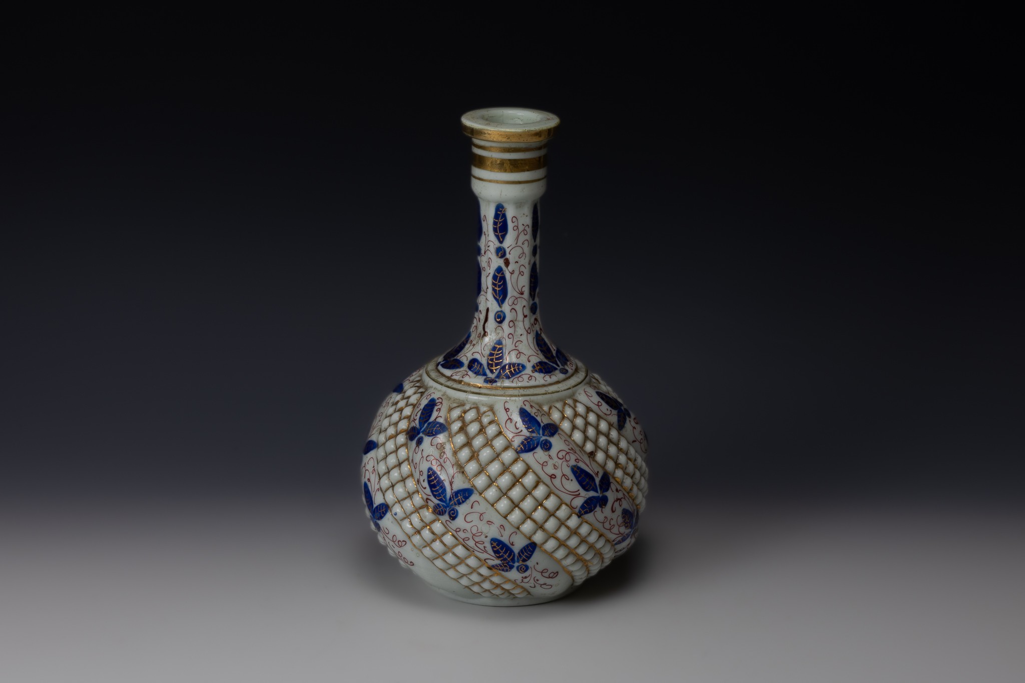 An Islamic Qajar Vase from the 19th Century Depicting Blue Butterflies and Floral Patterns.

H: Appr