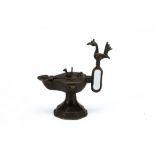 An Islamic Bronze Oil Lamp from the 12th Century.

H: Approximately 15cm 