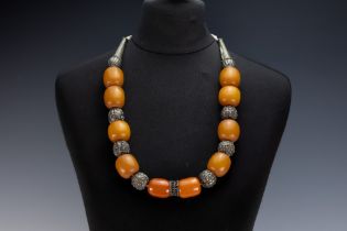 A Tribal Yemeni White Metal Necklace with Amber Colour Beads. 196g