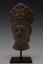 A Rare Terracotta Head Fragment Possibly Ancient on a Black Metal Base.

H: Approximately 22cm 