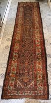 A Persian Shiraz Runner Rug from the 19th Century. L: Approximately 433cm W: Approximately 105cm