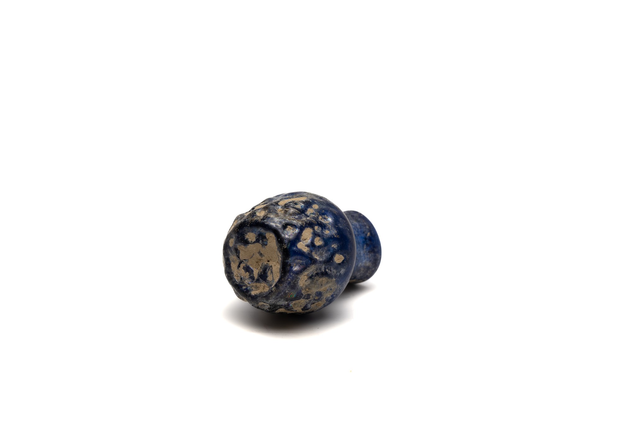 An Islamic Small Blue Moulded Glass with Patina from the 11-12th Century.

H: Approximately 5cm  - Image 3 of 3