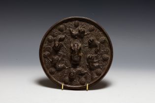 A Chinese Bronze Mirror Depicting Monkeys on the Back. D: Approximately 18cm