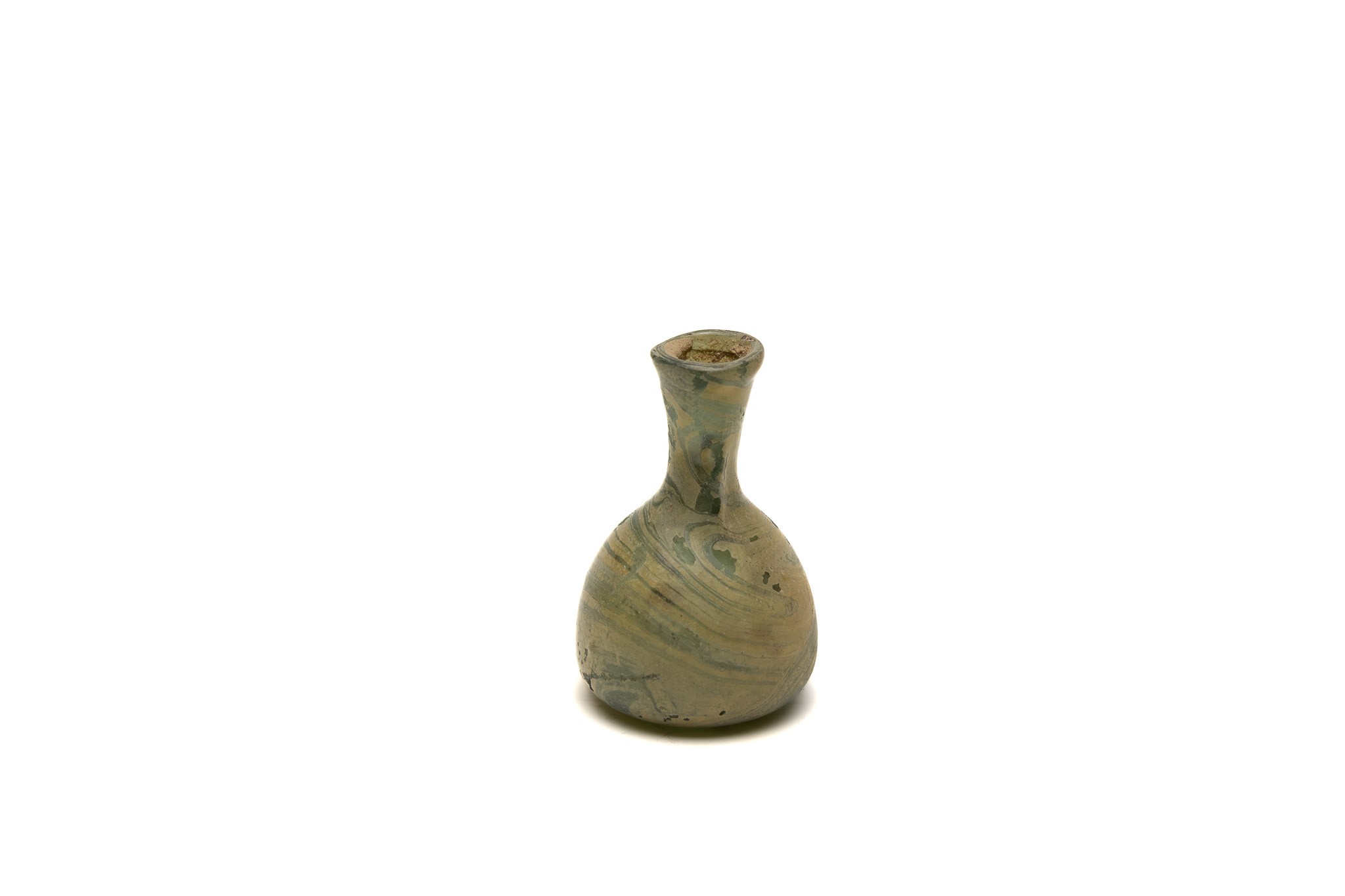 An Islamic Green Glass Small Bottle with Patina from the 11-12th Century.

H: Approximately 5.4cm  - Image 2 of 3