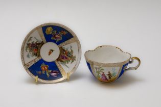 A Vintage Continental Blue & White Tea Cup and Saucer Depicting Floral Patterns with Character Marks