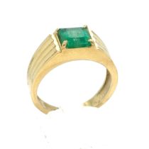 An Emerald and Diamond Ring in Yellow Gold.

Emerald Weight: Approximately 1.75ct 
Stamped 18K
Ring 