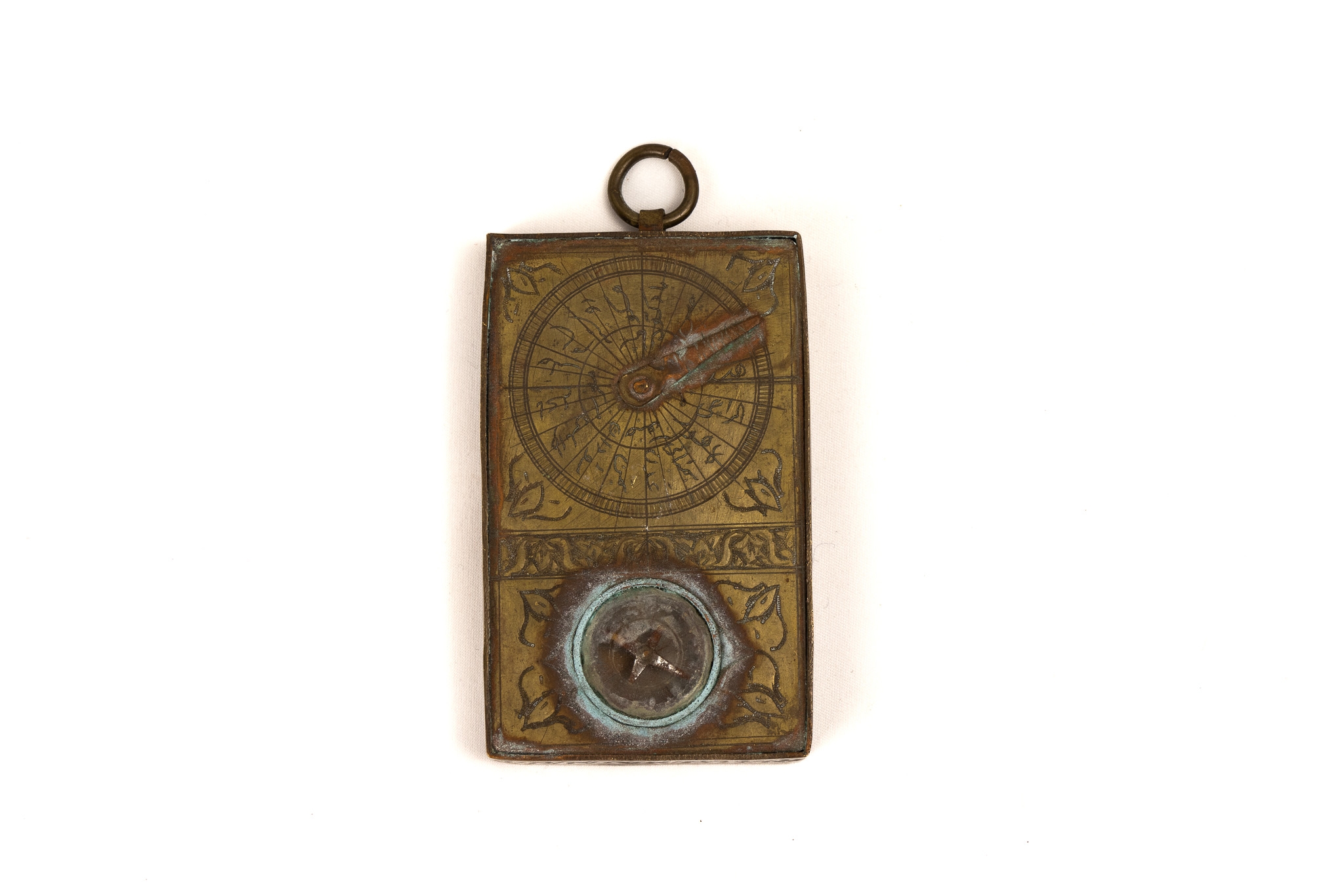 An Islamic Brass Pocket Compass.

Approximately 9.3x 5.8cm 