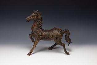 A Chinese Bronze Gilted Figure of a Prancing Horse. H: Approximately 29cm L: Approximately 31cm