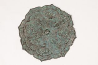 A Chinese Bronze Mirror Depicting Phoenixes and Floral Patterns. L: Approximately 22cm