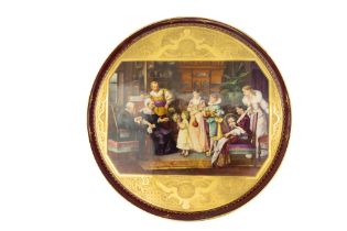 A Large Vienna Porcelain & Gilt Plate Depicting a Family Gathering from the 19th Century.

D: Approx