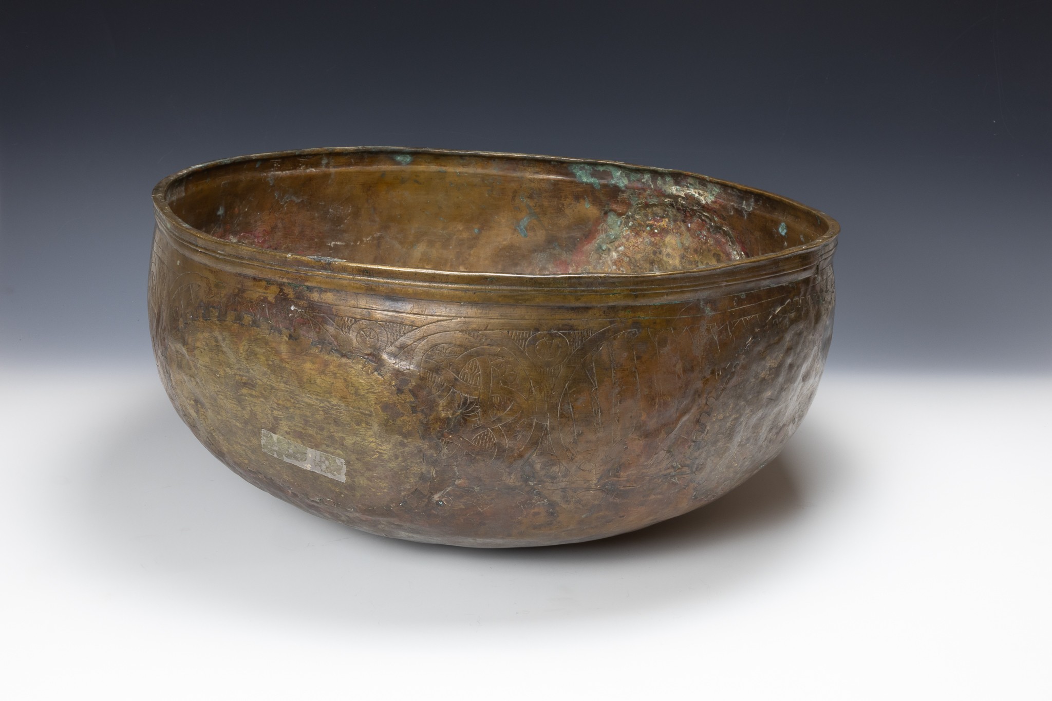 A Large Islamic Mamluk Brass Bowl from the 15th Century with Islamic Calligraphy Engraving.

D: Appr - Image 2 of 2
