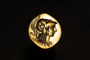 A God Signet Ring Decorated with Athena's Head, a Greek Goddess of Wisdom and War, in a Lively Manne