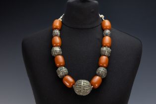 A Tribal Yemeni White Metal and Amber Colour Beads Necklace. 

173g 