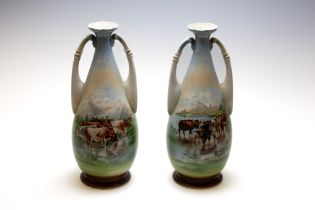 A Pair of Victorian Porcelain Vases from the 19th Century.

H: Approximately 35cm 