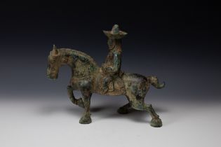 A Chinese Bronze Figure of a Man Riding a Horse Possibly Tang Dynasty. H: Approximately 31cm L: App