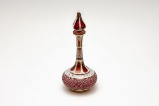 An Antique Bohemian Red Overlay Glass Cologne Bottle from the 19th Century.

H: Approximately 19.5cm