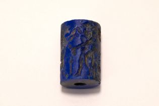 A Lapiz Lazuli Cylindrical Seal in the Style of the Awwadian Period.

L: Approximately 2.8cm 