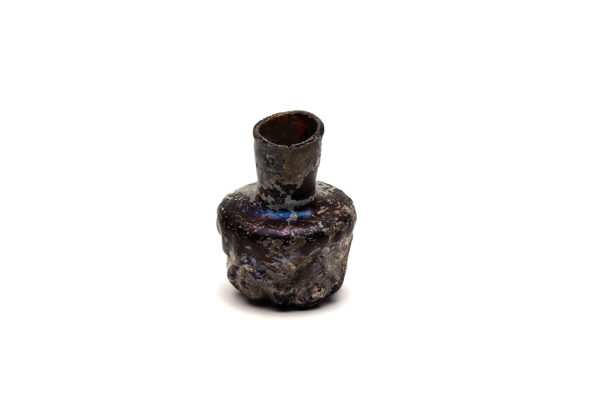 An Islamic Dark Glass Bottle with Lovely Patina and Design from the 11-12th Century.

H: Approximate - Image 2 of 4