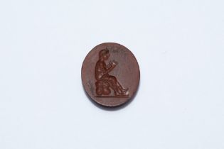 An Ancient Roman Red Circular Jasper Stone Depicting a Seated Woman. L: Approximately 1.7cm