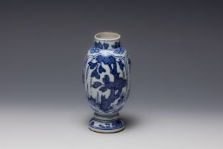 A Chinese Blue & White Vase from the 19th Century Qing Dynasty Depicting Floral Patterns.

H: Approx